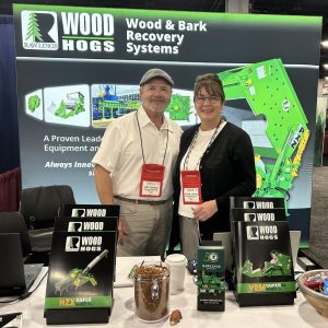 Photo of John and Judi Rawlings at their 2006 Biomass Conference booth